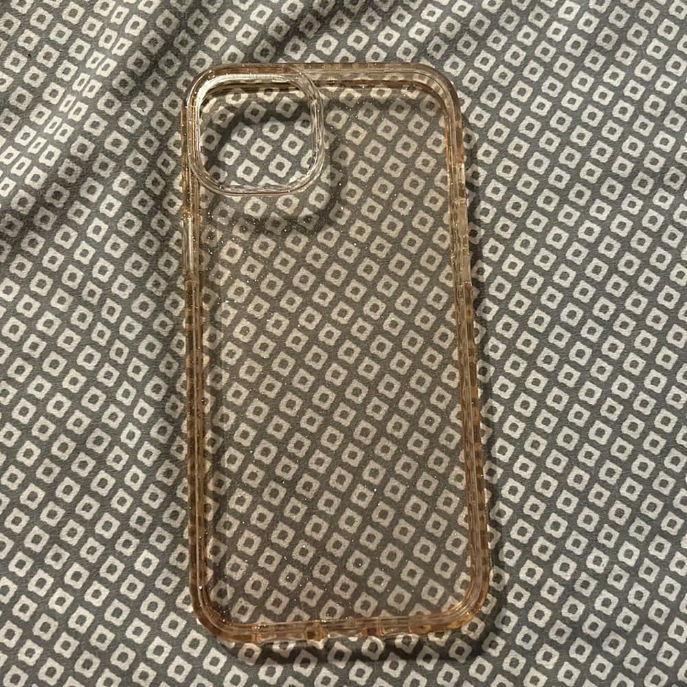 Hardly worn sparkly iPhone 14 plus case … looks discolored but it’s not.